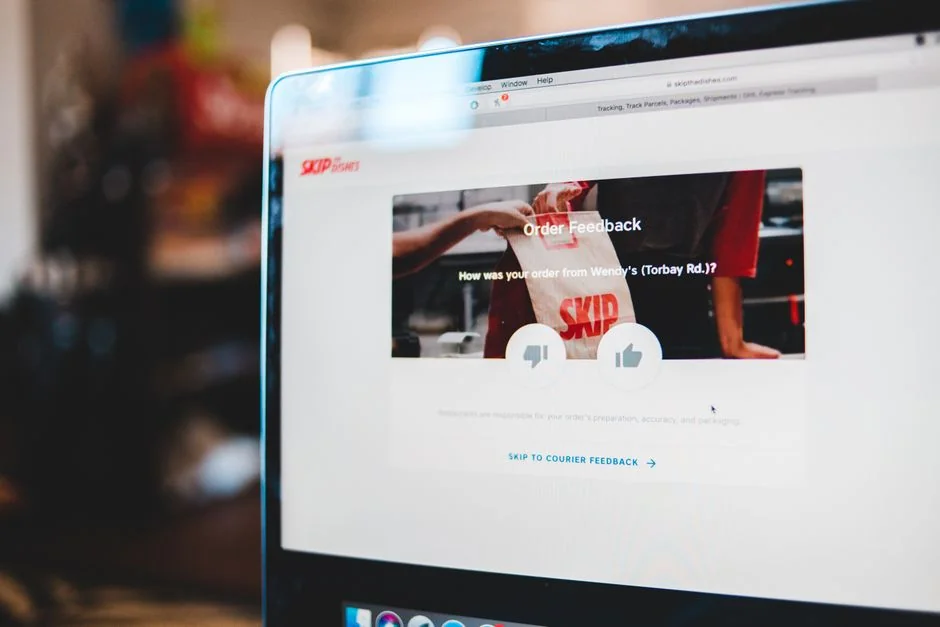 A modern computer screen displaying web design work, showcasing creative visuals in a workspace.